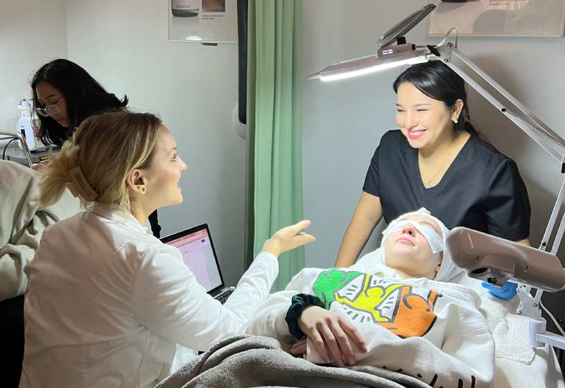 2e4edcf842545df464cce880fcaec1fd Esthetics Program Training - a woman looking at a man lying in a bed