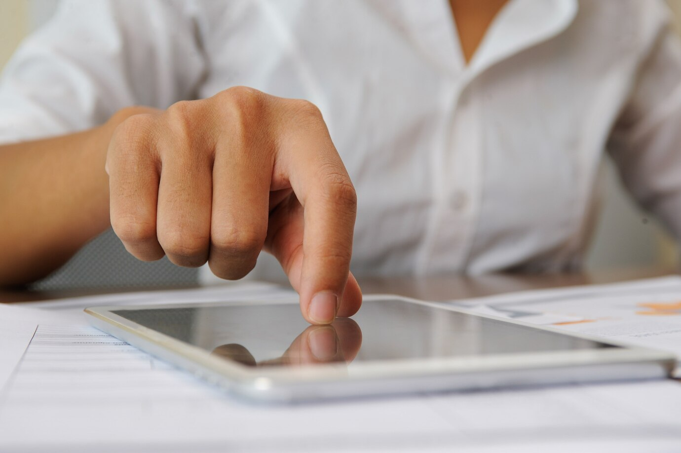 bdb43c9b462e36b9a6751b98332803f6 a person touching a touch screen device for application