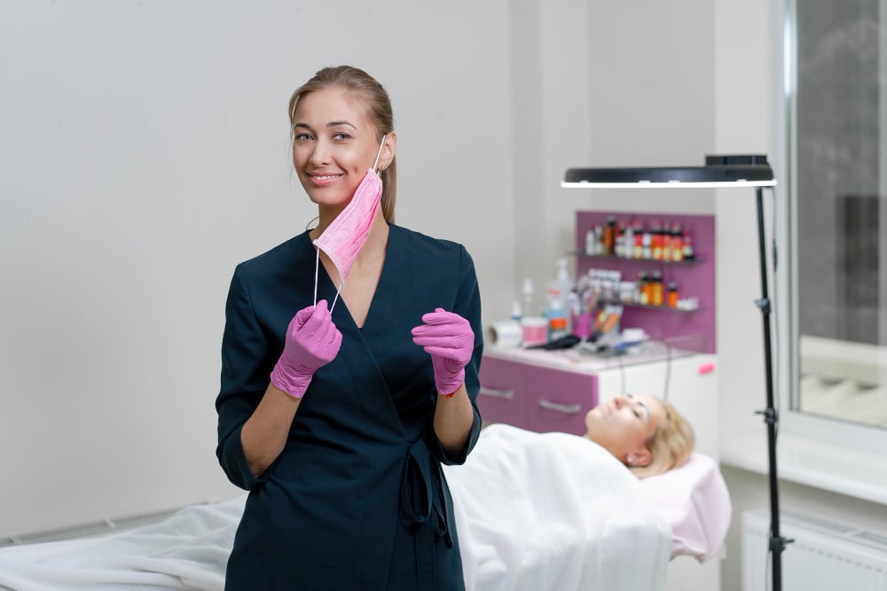 How to Become an Esthetician: 2026 Guide 4 Girl removing her mask posing for the camera