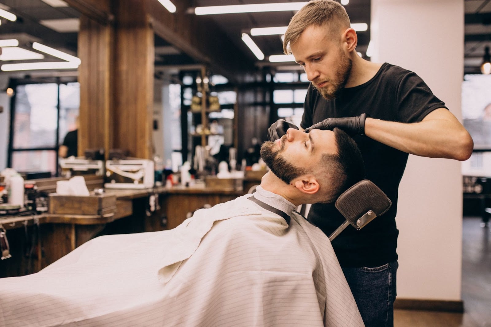 Barber student working with a client fade