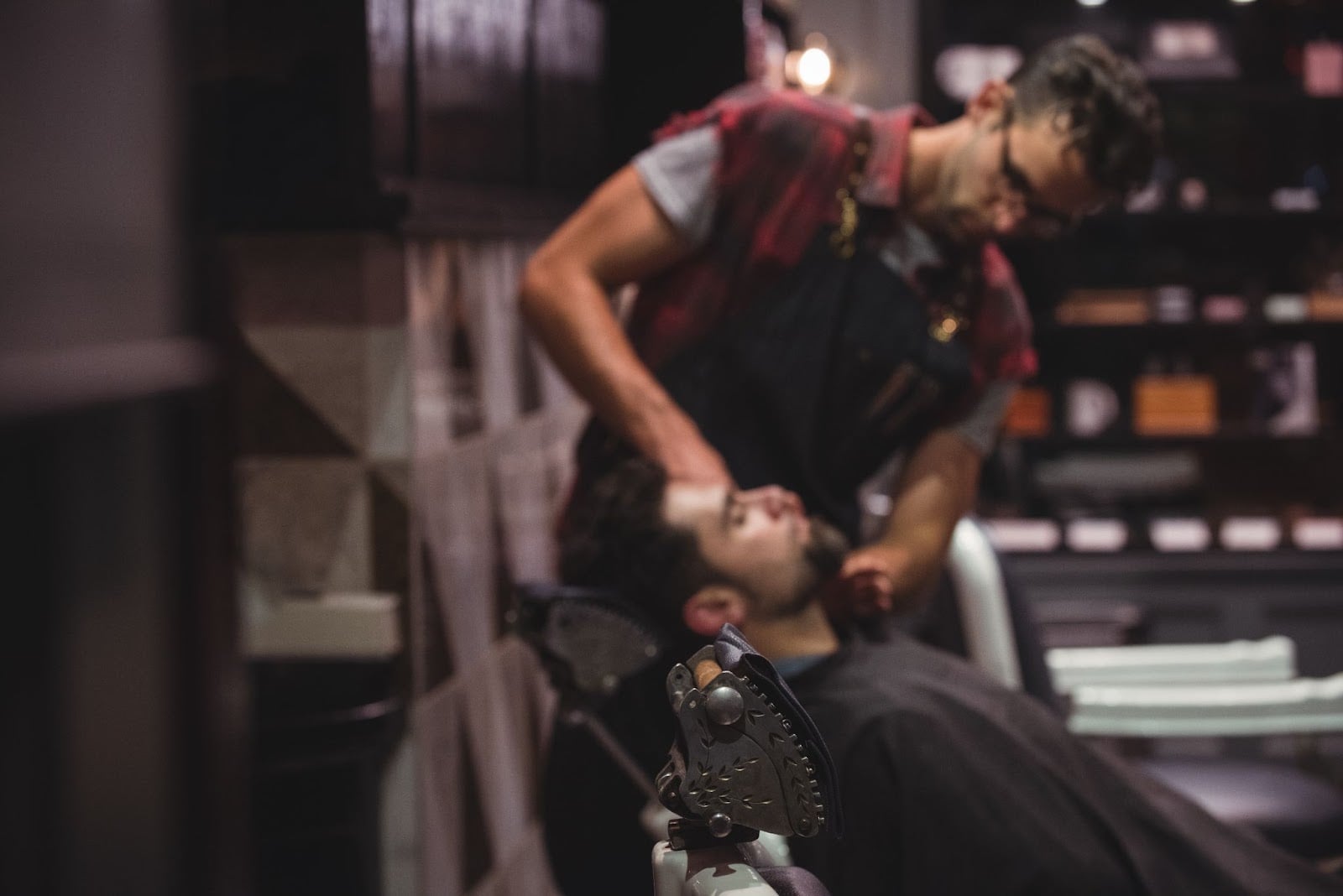 Barber working with a client