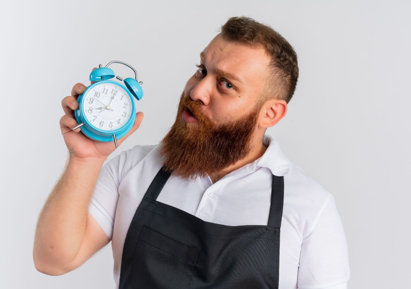 How Long Does It Take to Become a Barber in Illinois? 2 Man holding a watch in his hand