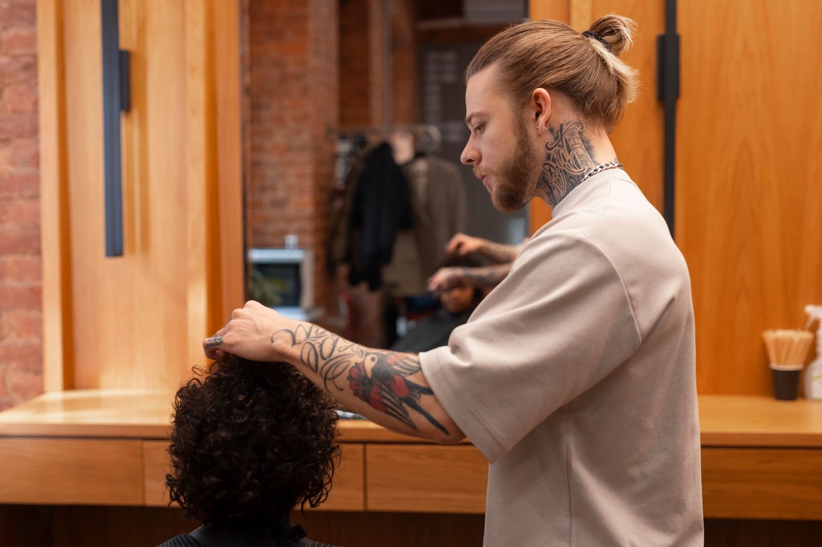 Barber student giving a haircut to a client.