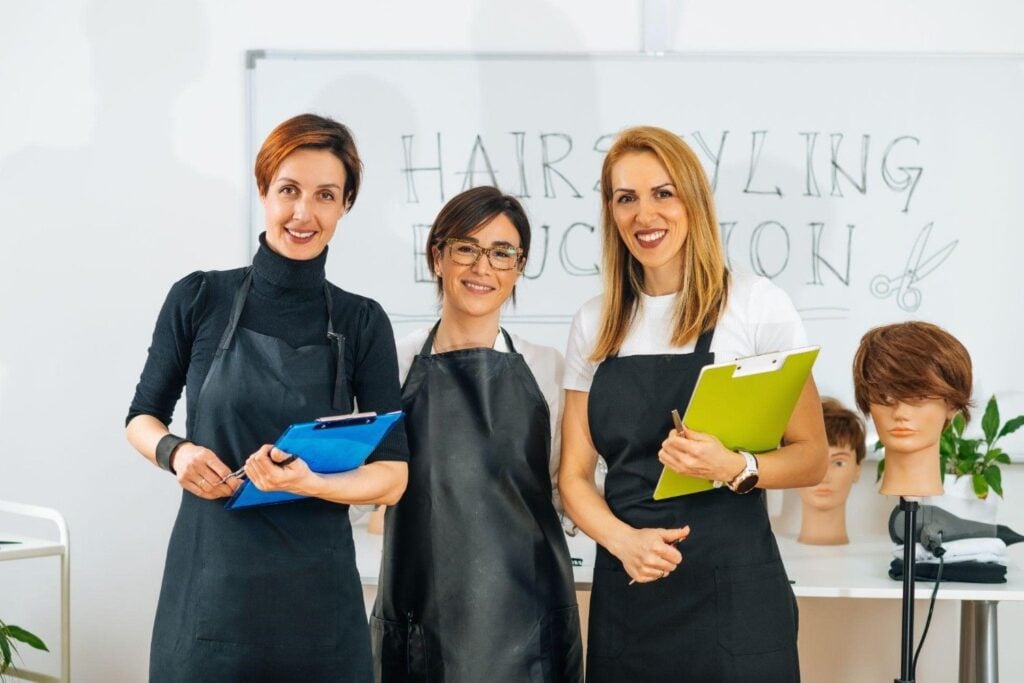 Teachers of different hair cutting and styling programs at a cosmetology school
