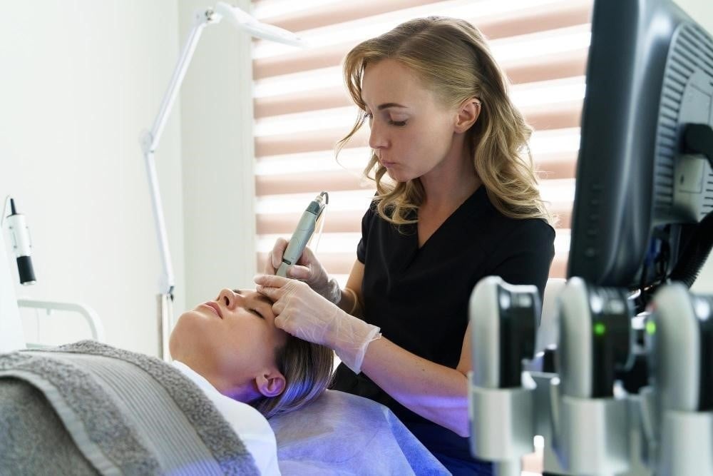 How to Become a Medical Esthetician 4 Student practicing skincare treatments during medical esthetician training.