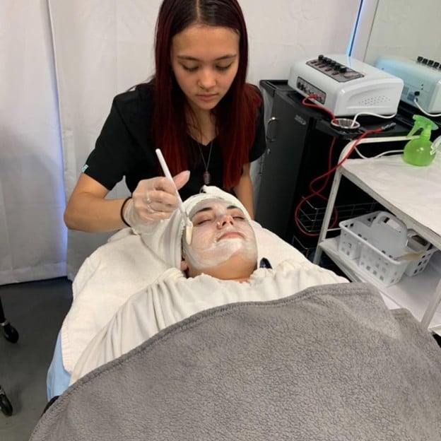 Top Recommended Skincare Brands for Cosmetology Students 3 Esthetics classes at CSA, student using professional skincare products