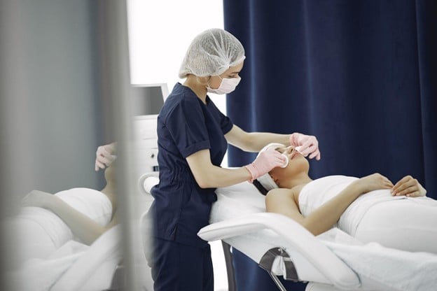 Oncology esthetician offering advanced skincare treatments 