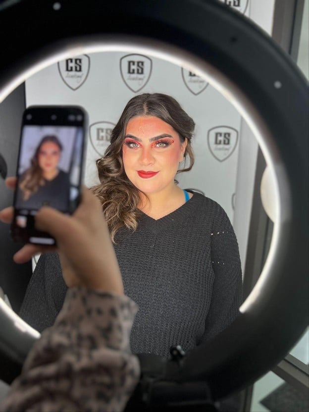 Completed professional makeup look photographed under studio lighting by a makeup artistry student at Cosmetology & Spa Academy.