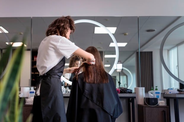 Hair Expert Cutting Hair of Female Client