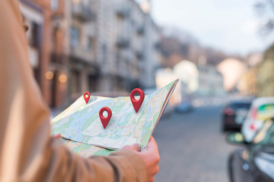 From Chair to Owner: How to Open Your Own Salon in Illinois 4 Person holding map with locations