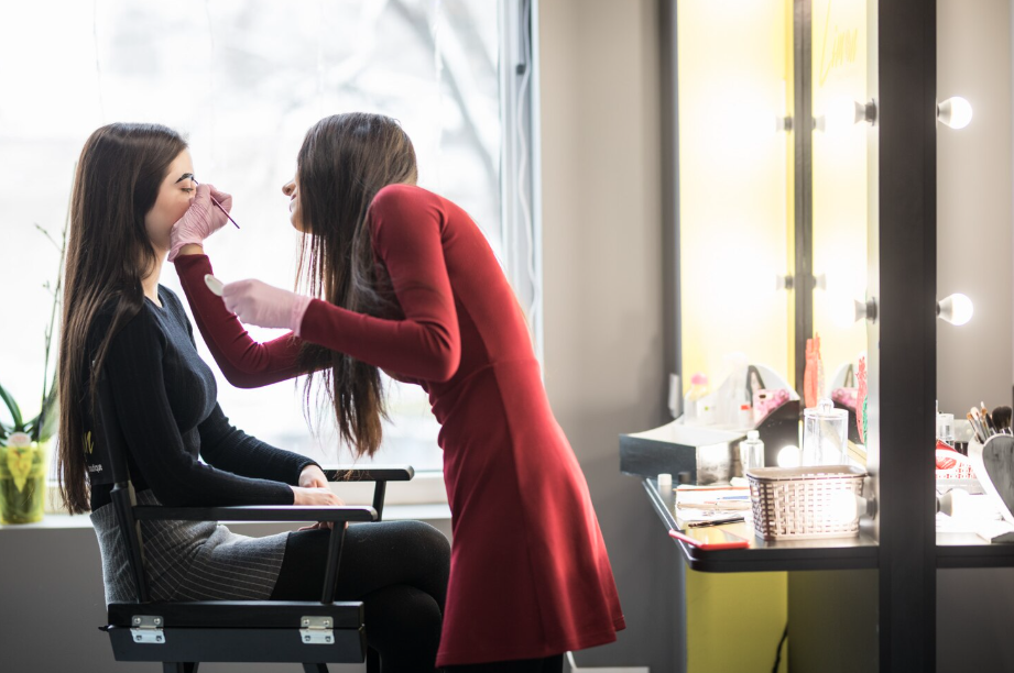 From Chair to Owner: How to Open Your Own Salon in Illinois 1 Makeup application in a salon.