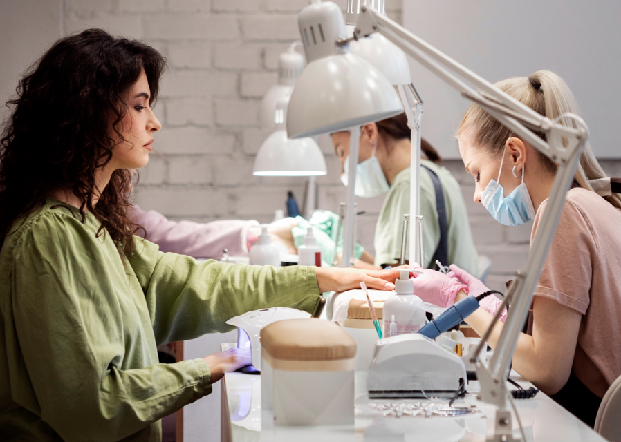 From Chair to Owner: How to Open Your Own Salon in Illinois 5 People getting manicures in salon.