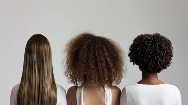 Hair Texture Guide: Styling Tips for Every Hair Texture 1 Comparison of straight, curly, and coily hair textures used in cosmetology training to understand hair types.