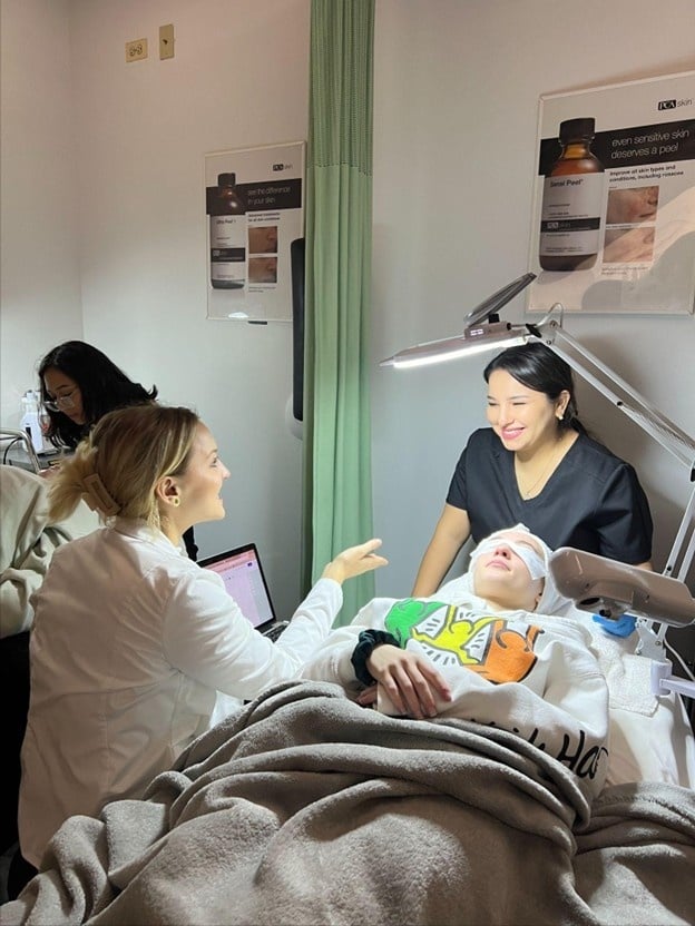 Ozempic Face: What It Is & How Estheticians Can Help 2 students learning about skin treatments at Cosmetology and Spa Academy, one of the best esthetician schools in Illinois