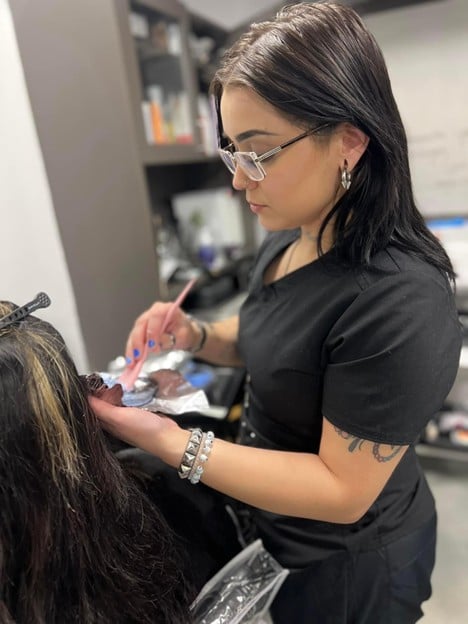 Oil Slick Hair Color for Brunettes: Full Hair Styling Guide 2 cosmetology school student practicing oil slick hair techniques