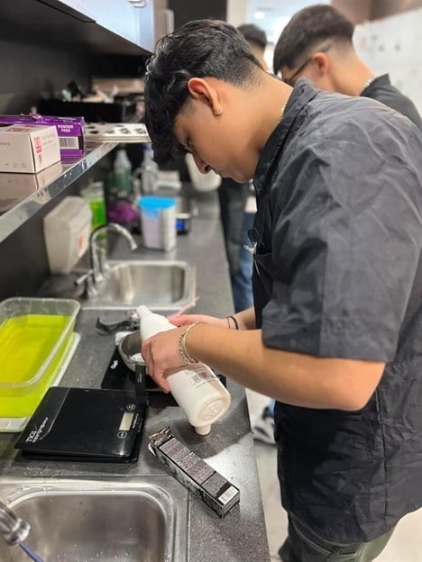 Your First Day of Cosmetology School: What to Expect and How to Prepare 3 student perparing hair dye at Cosmetology & Spa Academy, one of the best cosmetology schools in Illinois